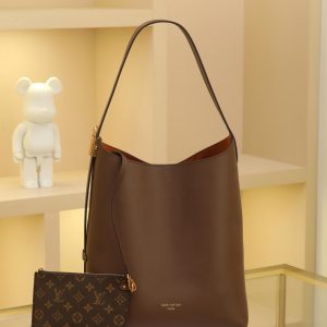 Chocolate Brown Low Key Hobo Medium Handbag Crafted from supple cowhide leather with clean, understated lines, this piece features a velvety suede lining that exudes contemporary flair, showcasing the brand's masterful craftsmanship. An adjustable shoulder strap is adorned with a signature monogrammed padlock, while ample interior space effortlessly accommodates daily essentials like a laptop. Dimensions: 31.0 x 35.0 x 18.0 cm